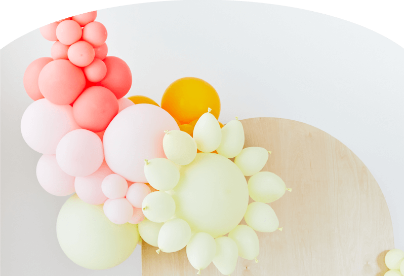 Float Balloons Hero Image pink background lady with balloons