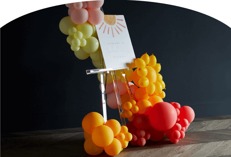 Float Balloons Hero Image pink background lady with balloons