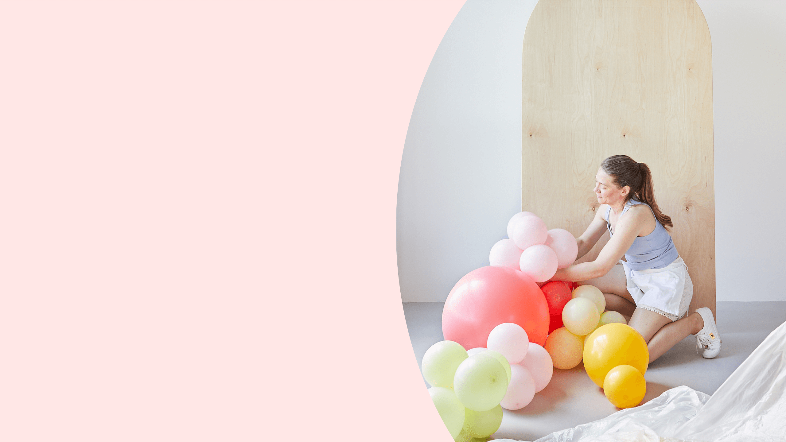 Float Balloons Hero Image pink background lady with balloons 