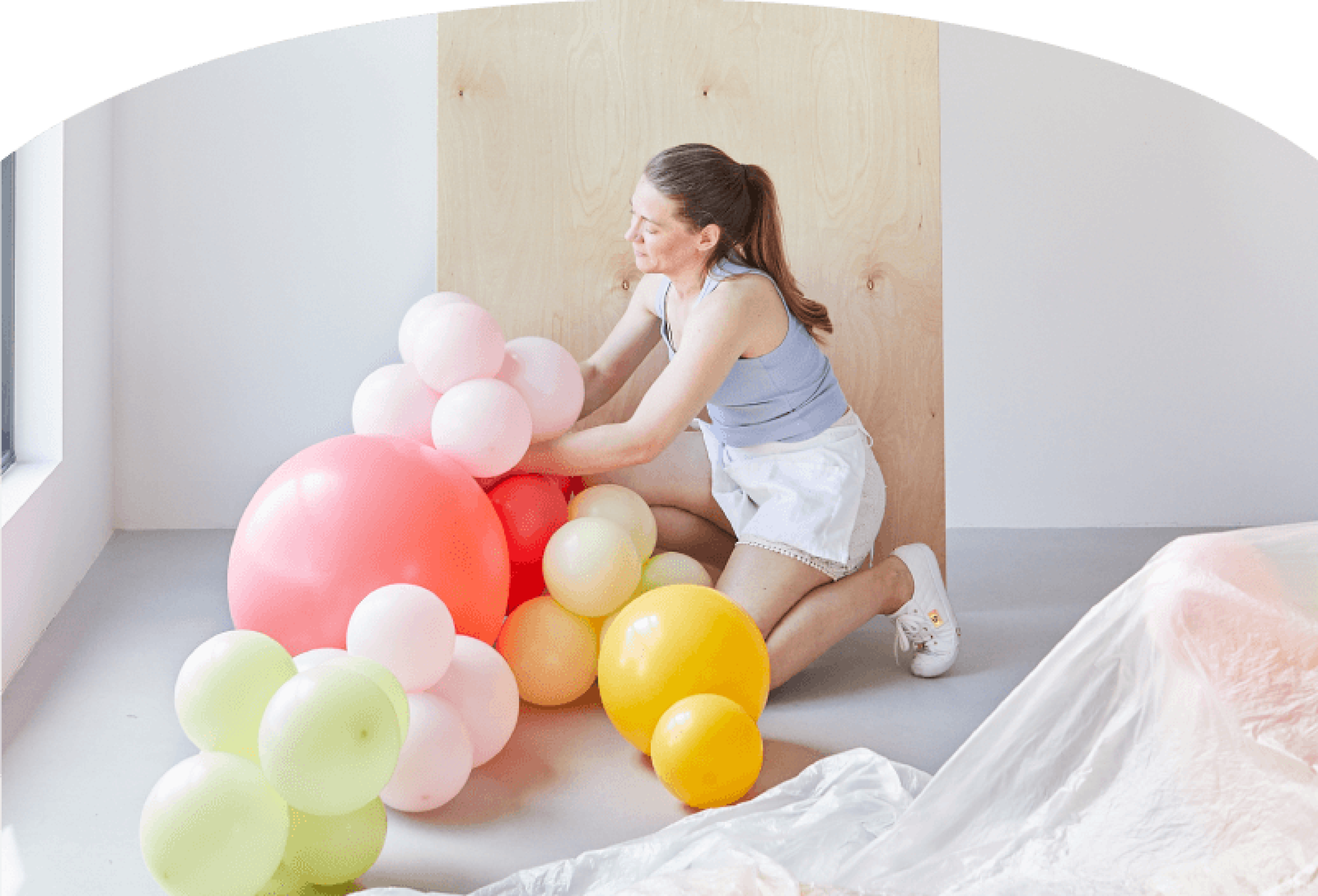 Float Balloons Hero Image pink background lady with balloons 