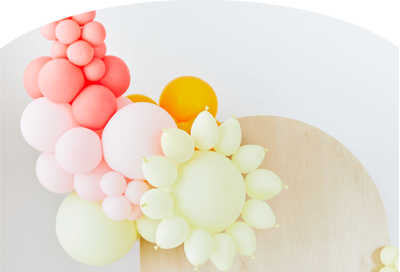 Float Balloons Hero Image pink background lady with balloons 